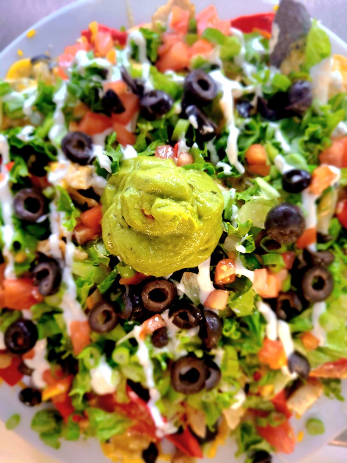 Loaded station nachos with queso, pico and sour cream