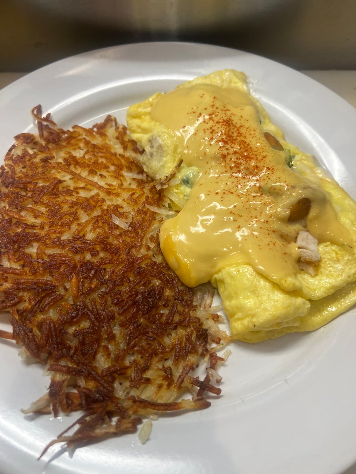 Chicken Kiev omelette covered in hollandaise