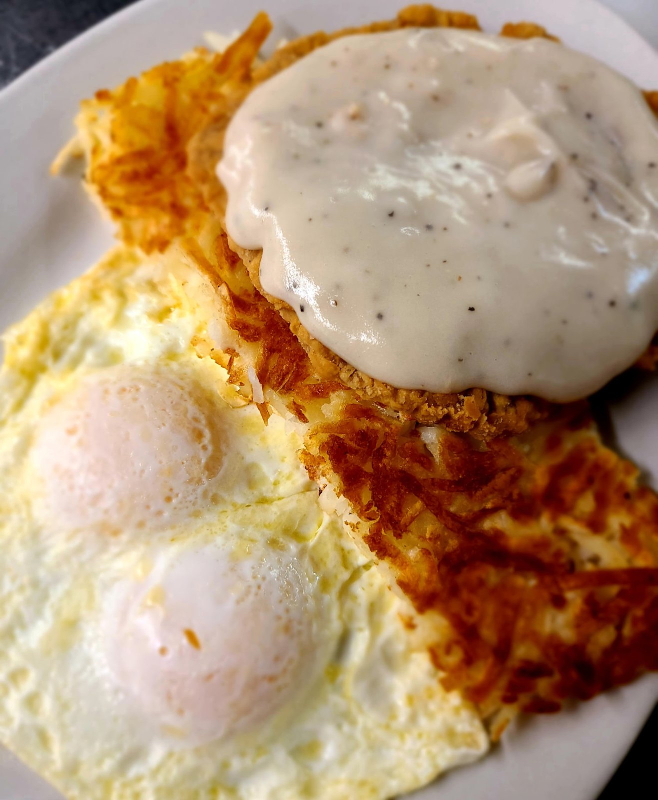 Country fried steak skillet smothered in sausage gravy