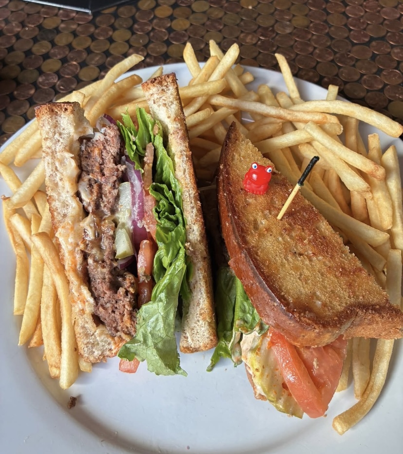 Patty melt burger served with fries