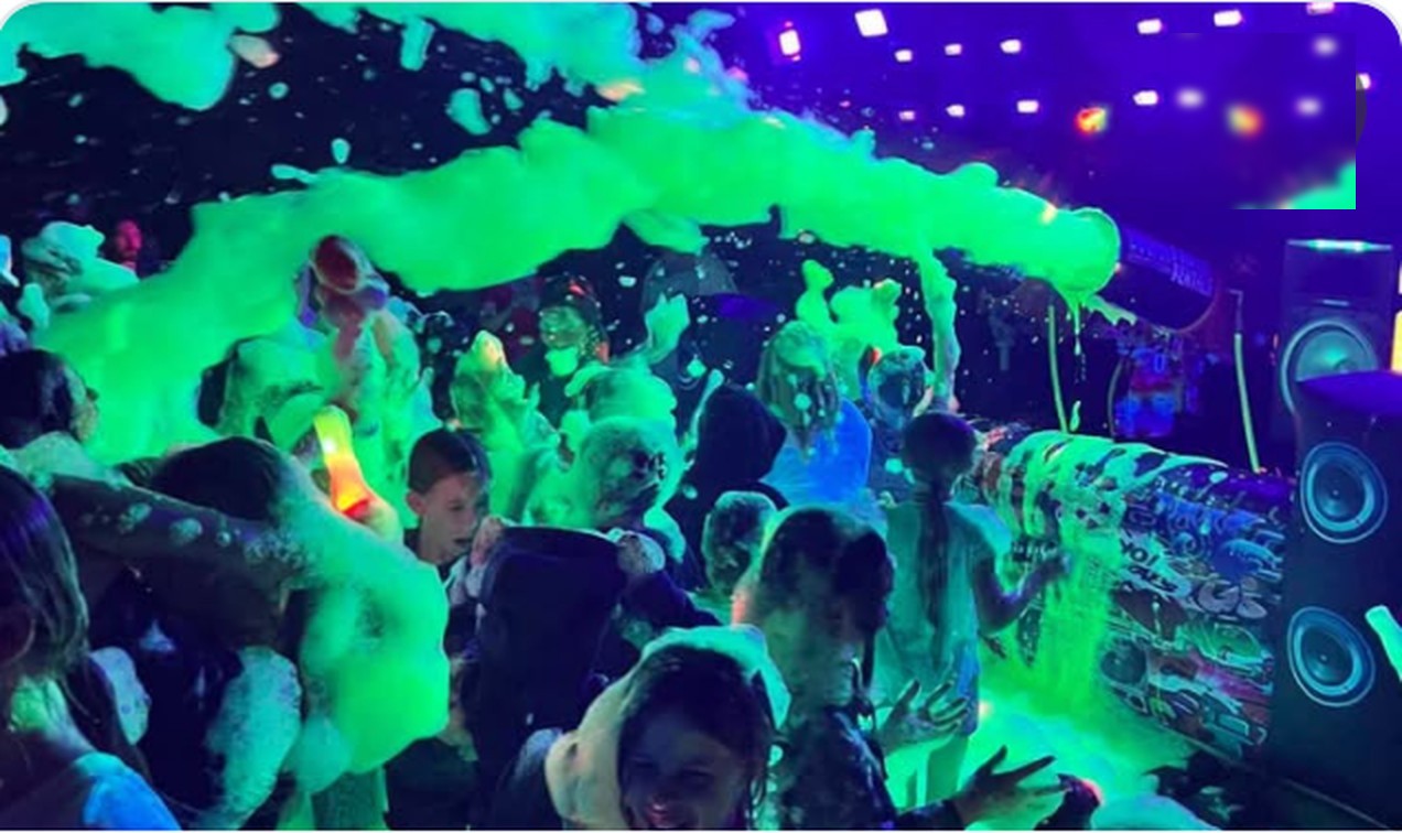 Neon foam party crowd on the Kickstand patio