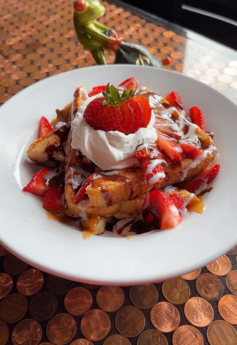 French toast topped with strawberries and whipped cream