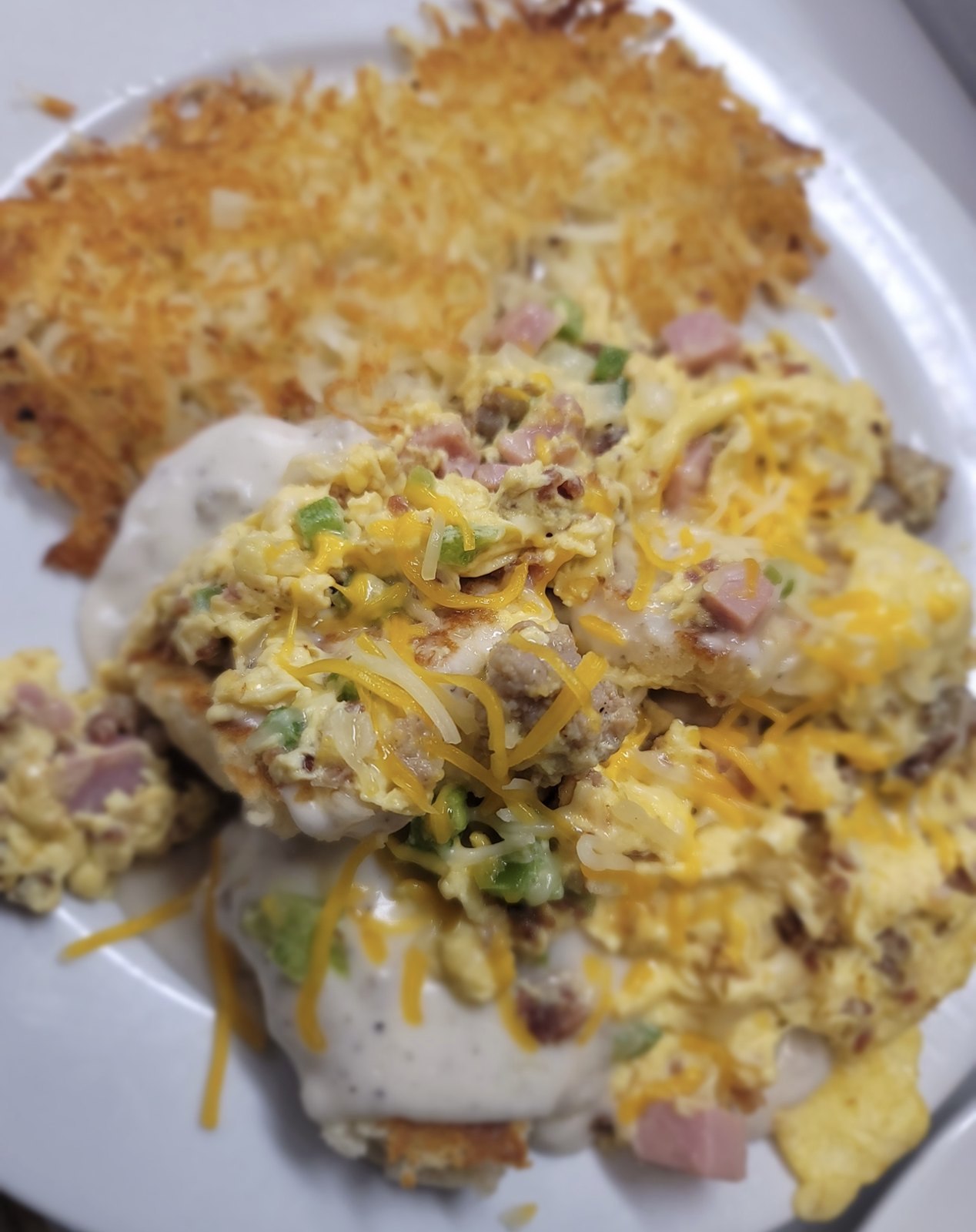 Loaded biscuits and gravy with eggs, peppers and cheese