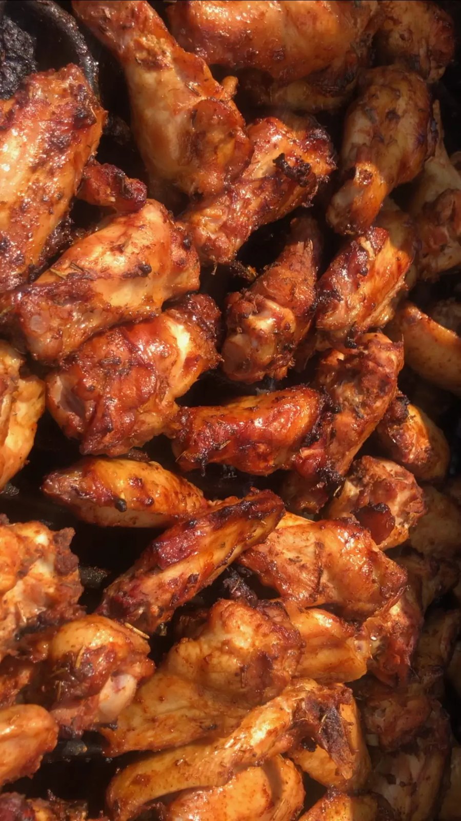 Smoked bone-in wings tossed in sauce