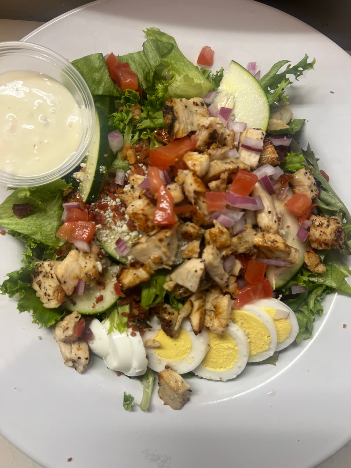 Chef salad with grilled chicken, egg and fresh vegetables
