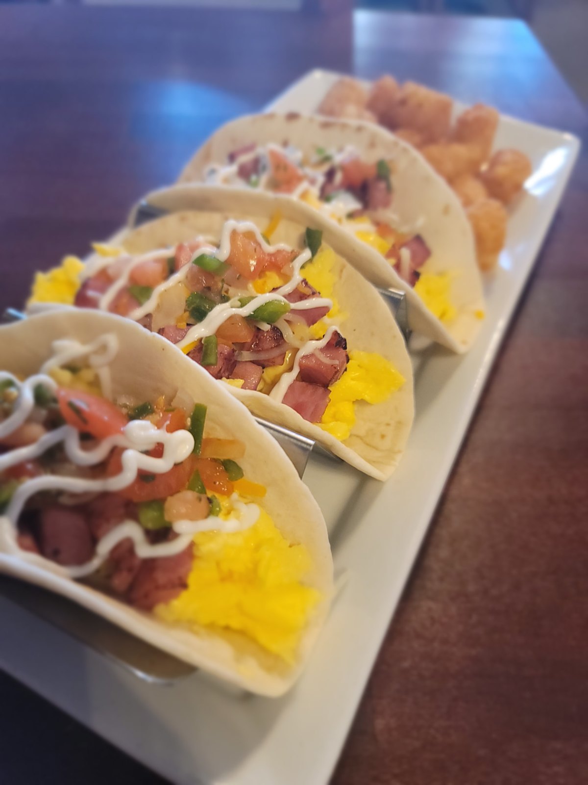 Breakfast tacos with scrambled eggs, cheese and pico