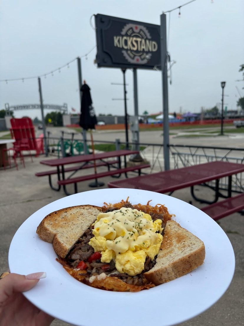 Open-faced breakfast sandwich with scrambled eggs on toast