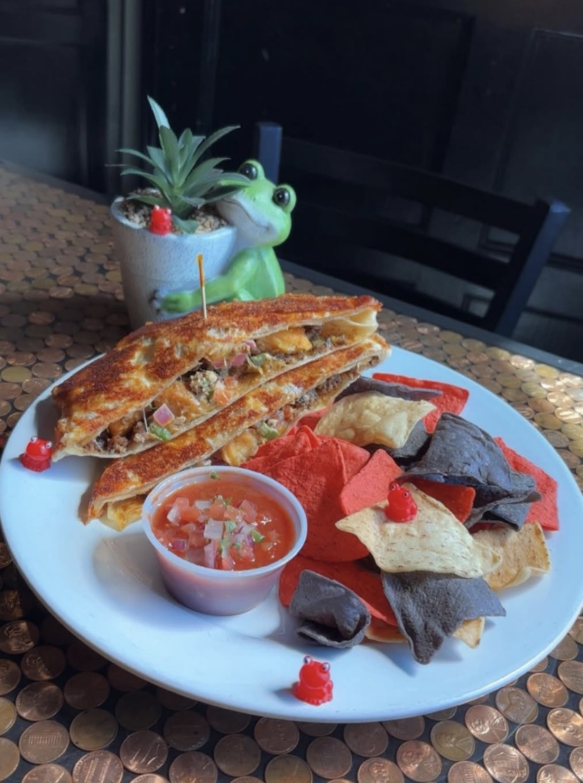 Steak quesadilla served with salsa and tortilla chips