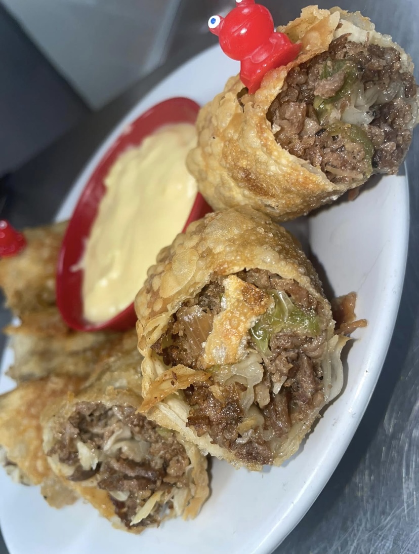 Crispy stuffed wontons served with cheese sauce