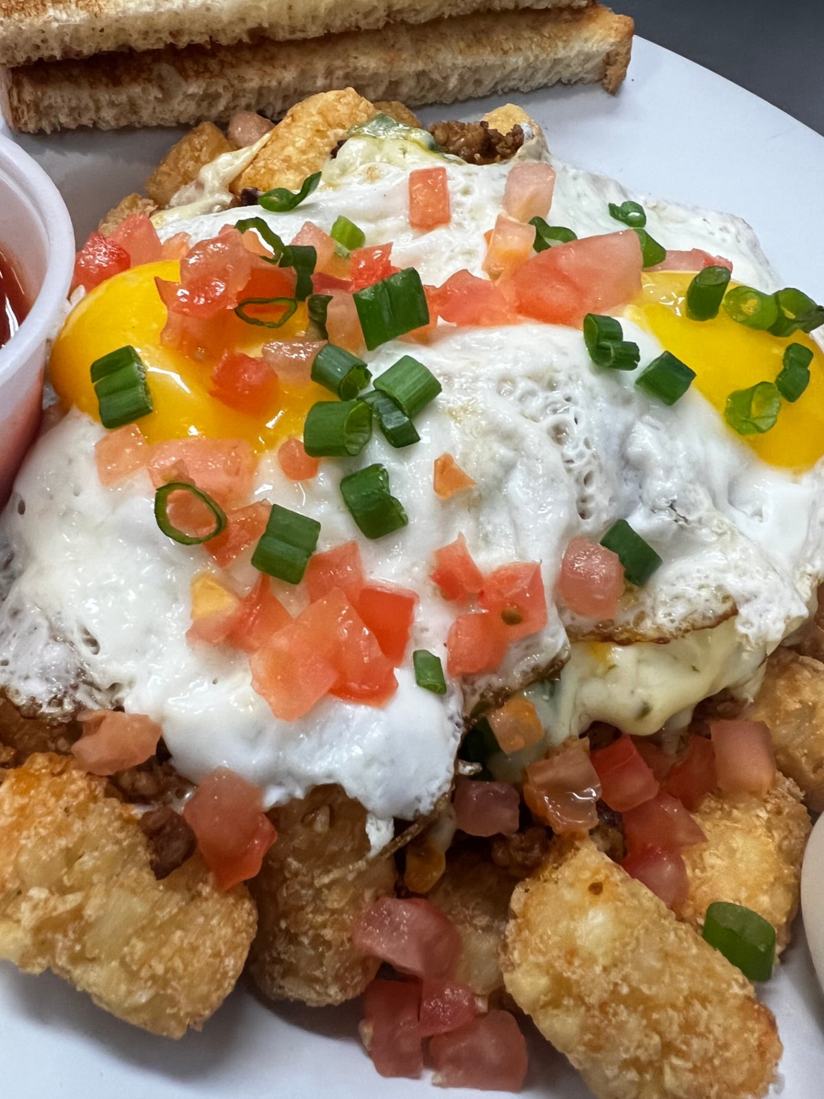Huevos skillet served over tater tots